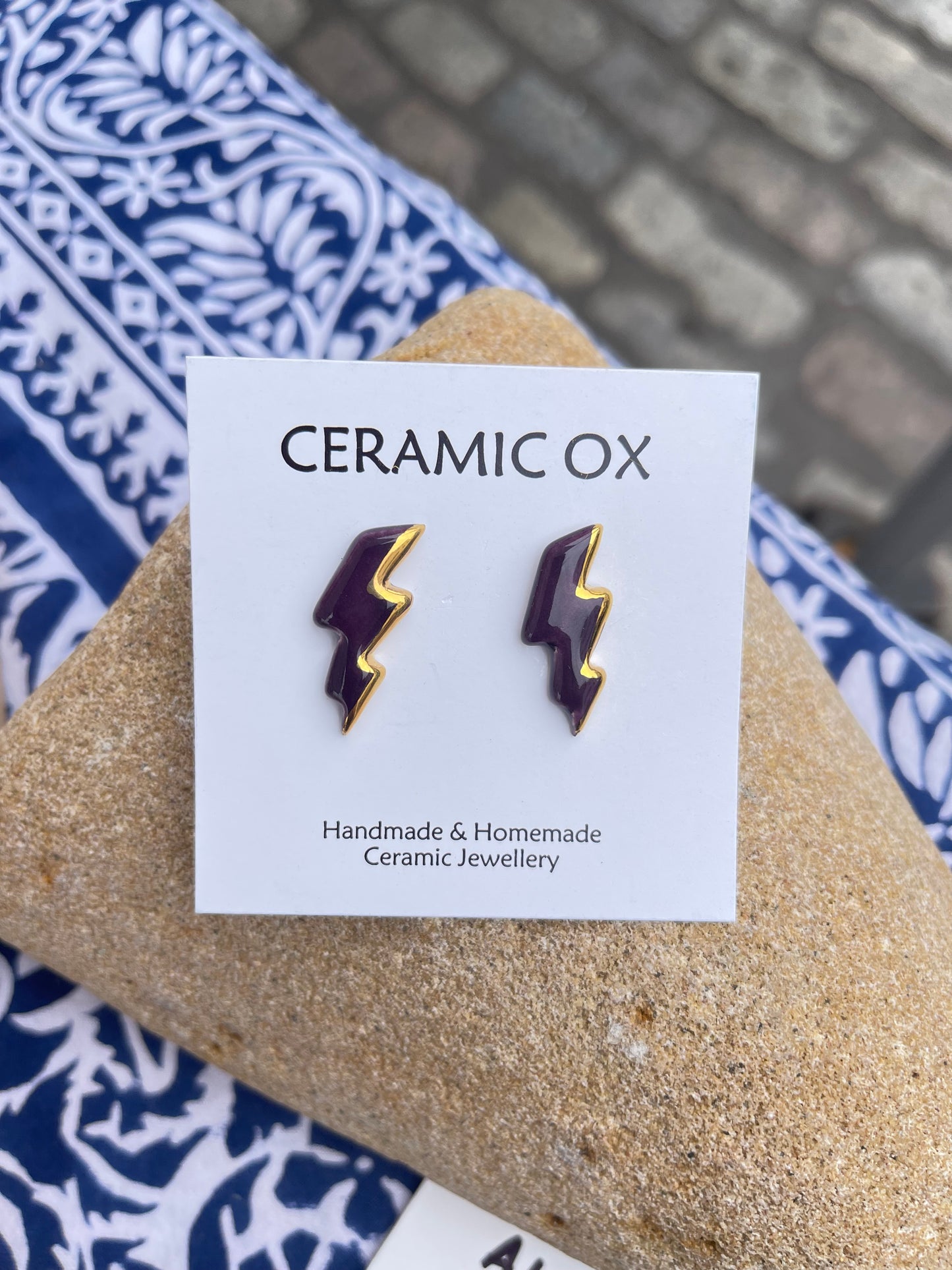 Deep purple lightening bolt studs