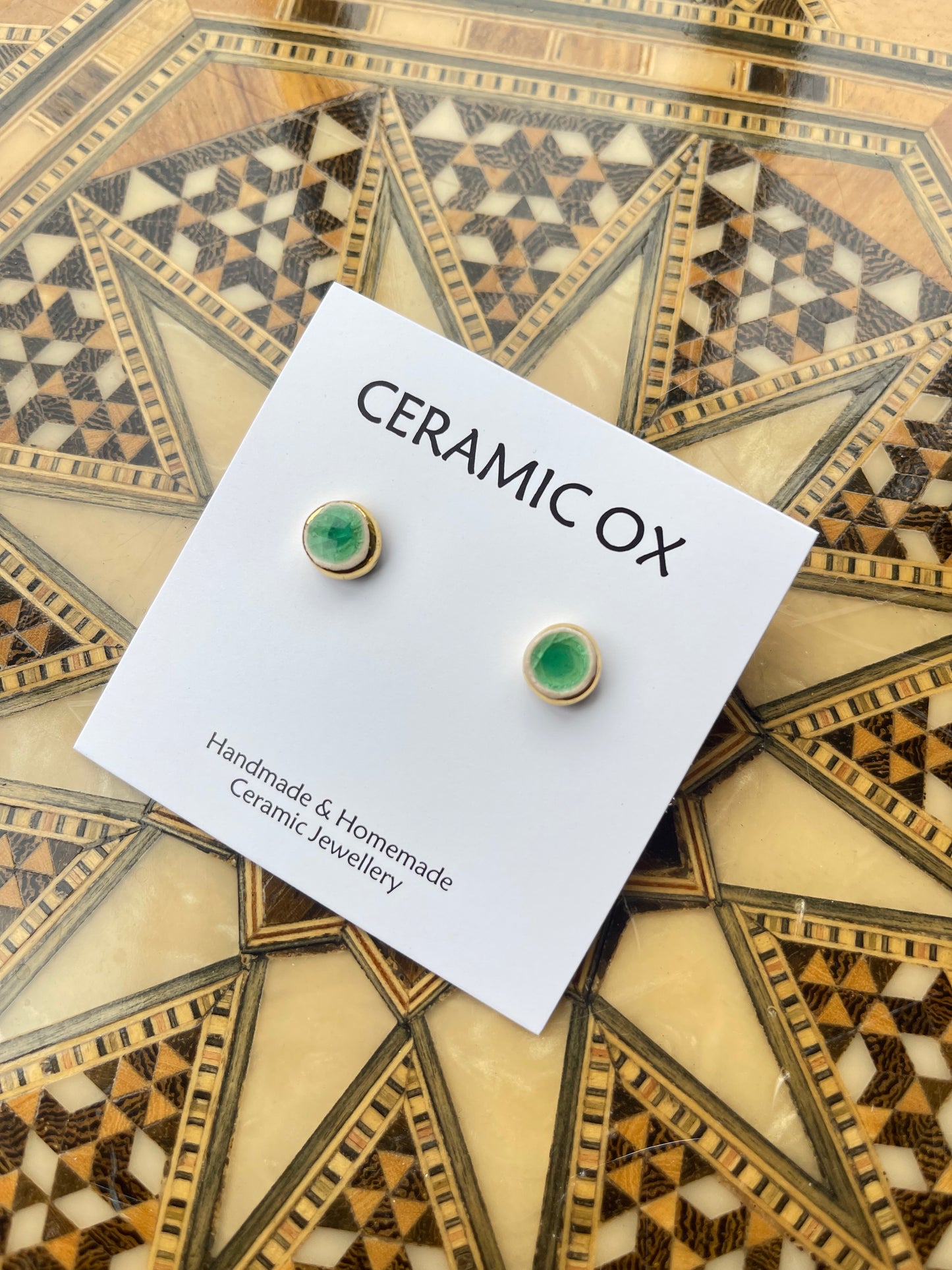 Tiny green glass studs